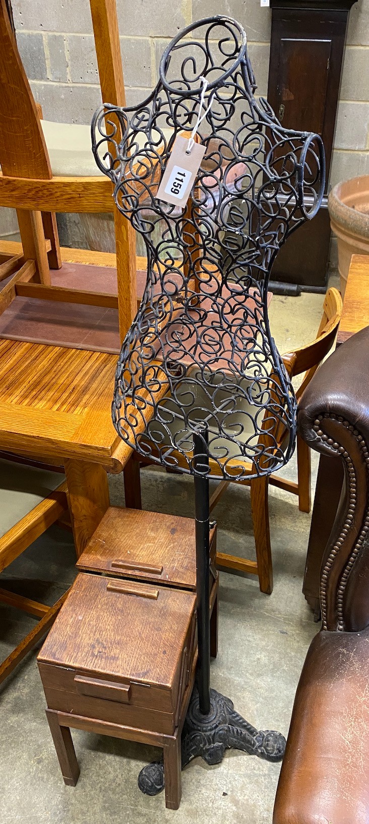 A reproduction wrought and cast iron tailor's dummy, height 150cm and an oak work box